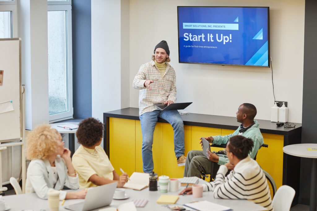 Startup Spotlight: Entrepreneurial Journeys and Growth Startup founders analyzing capital investment charts and growth metrics during a pitch meeting.