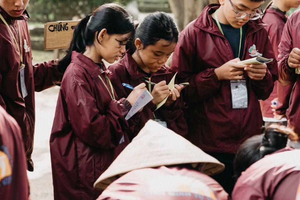 global students collaborating during an education workshop focused on sdg 4 goals.