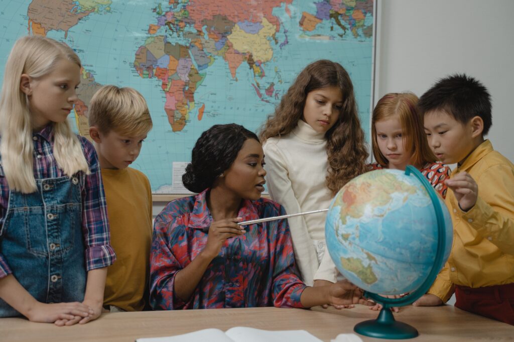 professional infographic comparing education progress across world regions between 2000 and 2026.